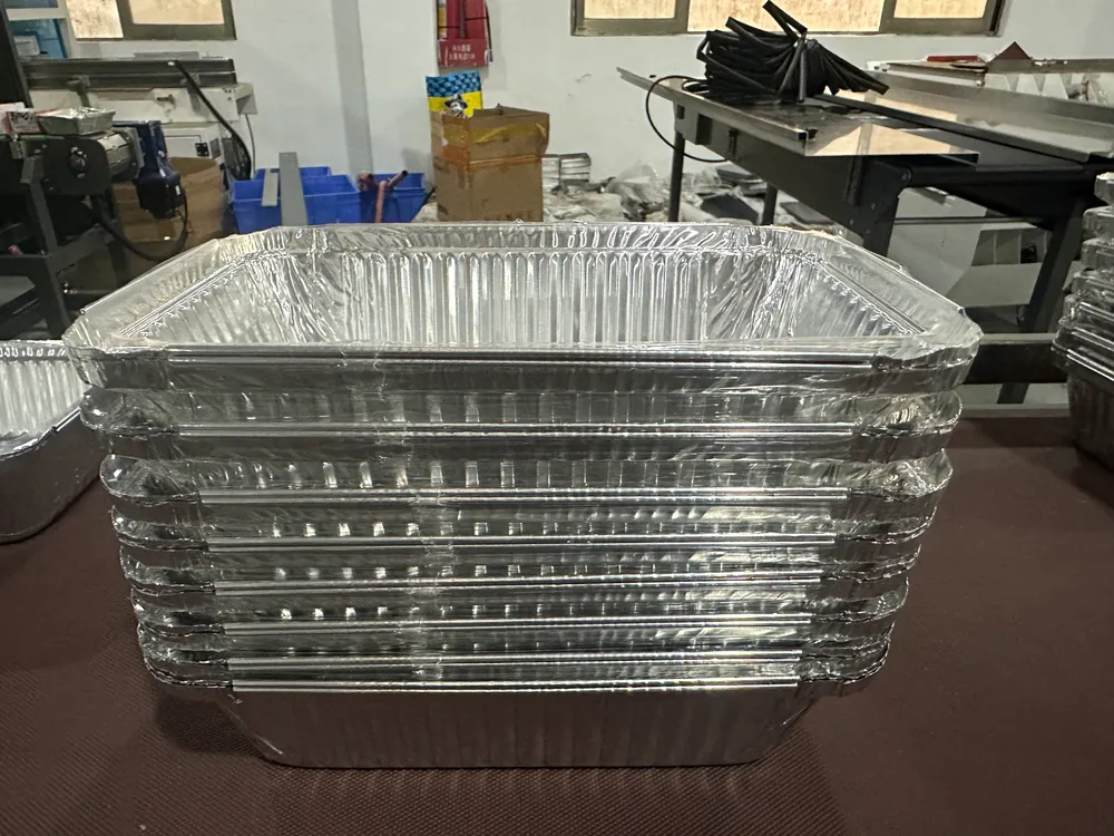 Aluminum foil containers on conveyor