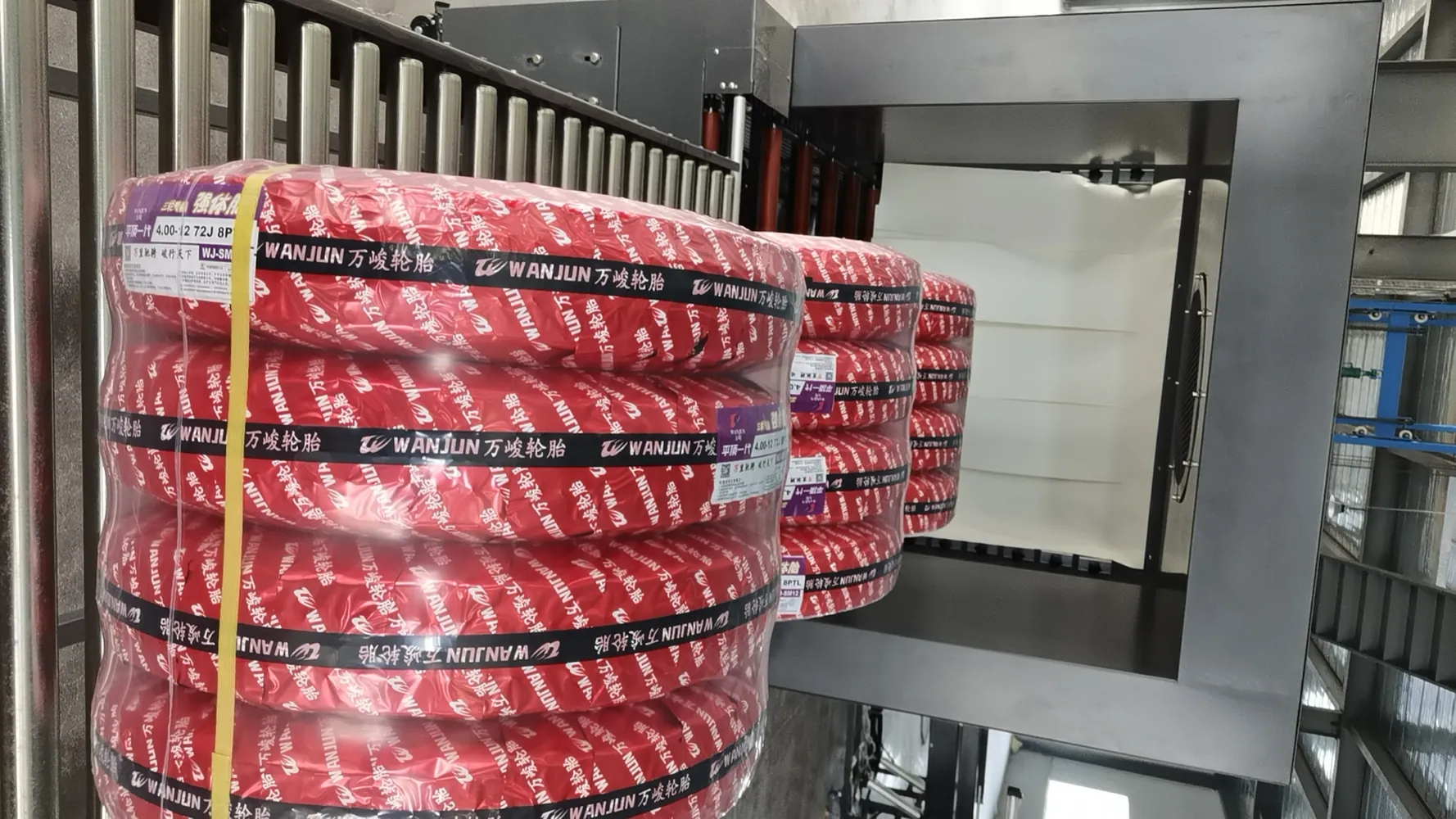Tire with Shrink Film and Black Strap — Close-up
