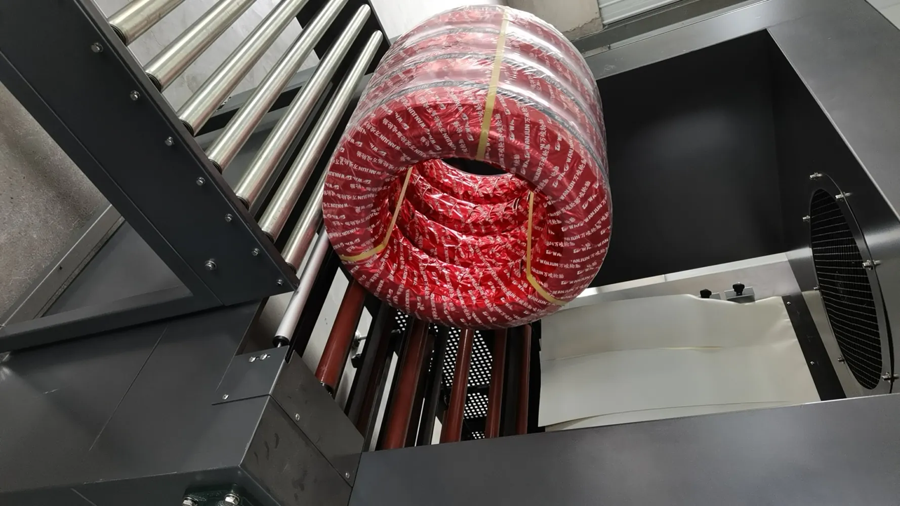 Single Tire Exiting Shrink Tunnel